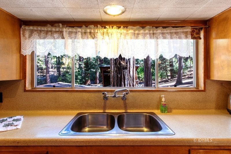 27401 Saunders Meadow Road Idyllwild, CA 92549 - Photo 24 of 37 a view of a sink and a window