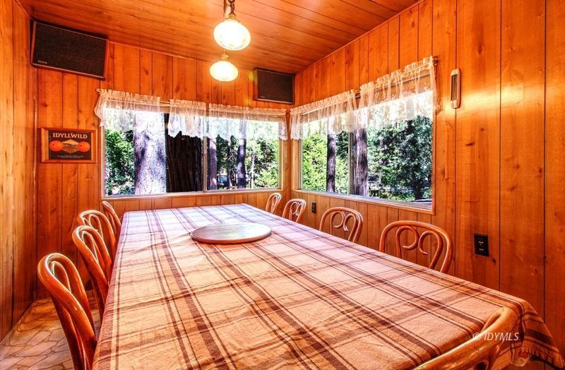 27401 Saunders Meadow Road Idyllwild, CA 92549 - Photo 26 of 37 a bedroom with a bed and lamp next to a window
