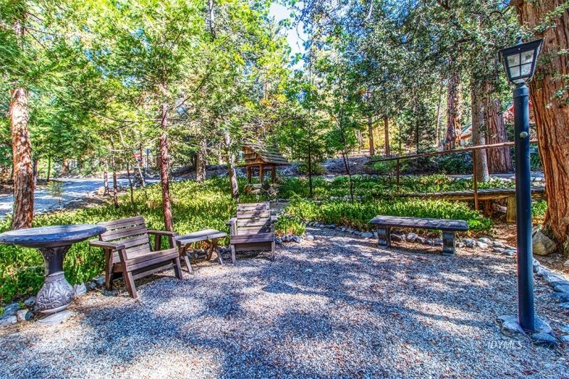 27401 Saunders Meadow Road Idyllwild, CA 92549 - Photo 7 of 37 a view of a bench in a garden