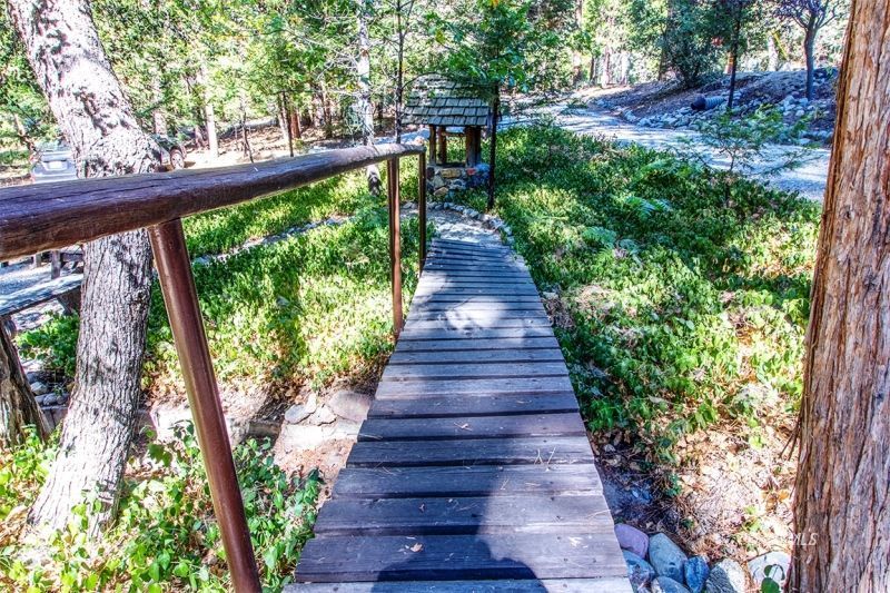 27401 Saunders Meadow Road Idyllwild, CA 92549 - Photo 8 of 37 a view of a garden with wooden floor