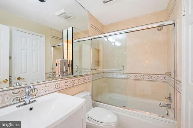 a bathroom with a shower a mirror and a shower