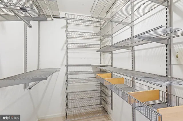 a view of a balcony with two chairs and a stairs