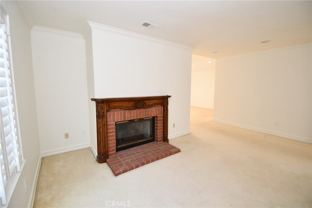 2123 Shelburne Way, Unit 29 Torrance, CA 90503 - Photo 17 of 41 a living room with a fireplace