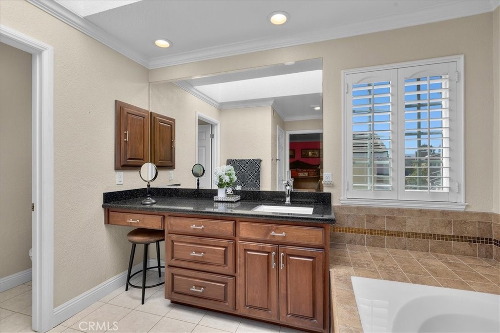 2123 Shelburne Way, Unit 29 Torrance, CA 90503 - Photo 21 of 41 a bathroom with a sink double vanity granite and a mirror