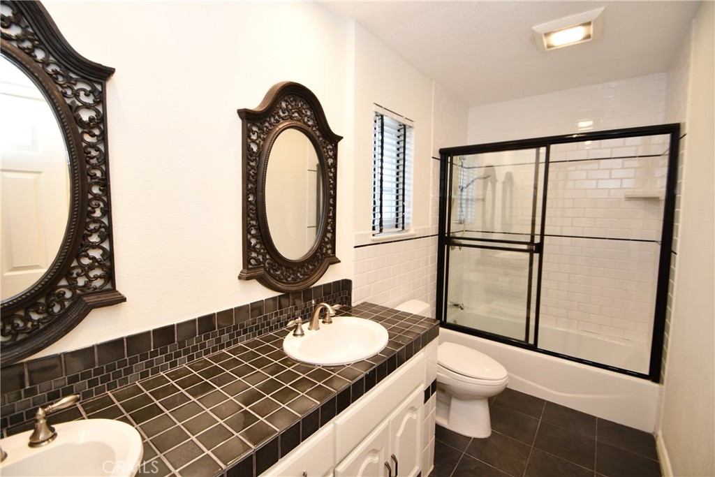 2123 Shelburne Way, Unit 29 Torrance, CA 90503 - Photo 27 of 41 a bathroom with a sink toilet and mirror