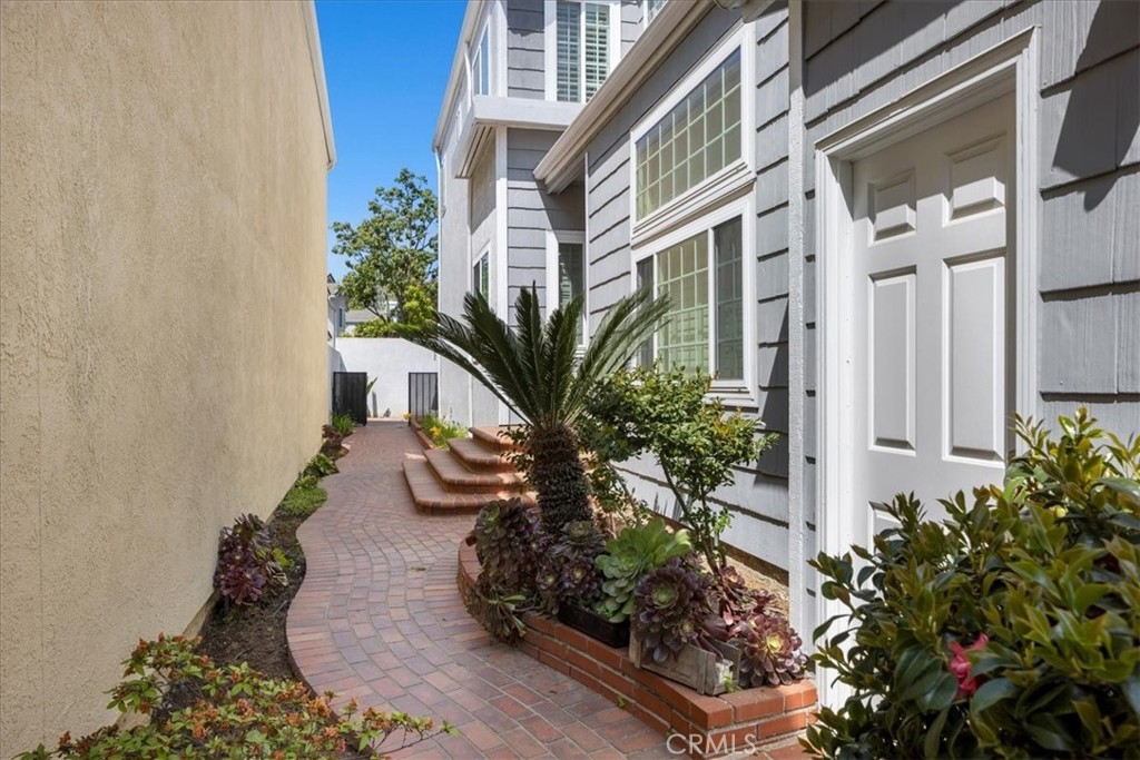 2123 Shelburne Way, Unit 29 Torrance, CA 90503 - Photo 31 of 41 a view of path along with potted plants