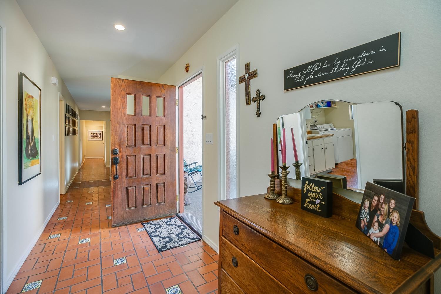 804 Daly Road Ojai, CA 93023 - Photo 6 of 38 a hallway with a large mirror on a dresser