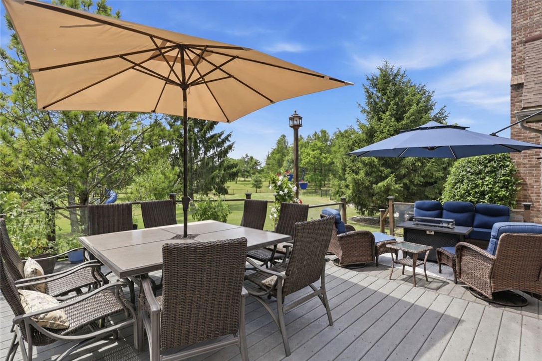 2057 Stirnie Road Victor, NY 14564 - Photo 35 of 48 View of the rear wood deck off the main living area, offering a private, scenic overlook of the home's gorgeous 5.10 acre country grounds!