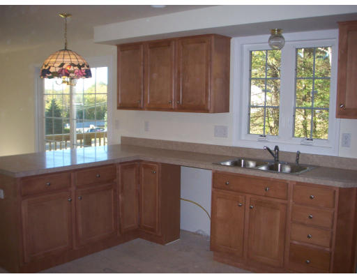 7 Hardy Road Ashburnham, MA 01430 - Photo 2 of 6 a kitchen with granite countertop stainless steel appliances a sink window and cabinets