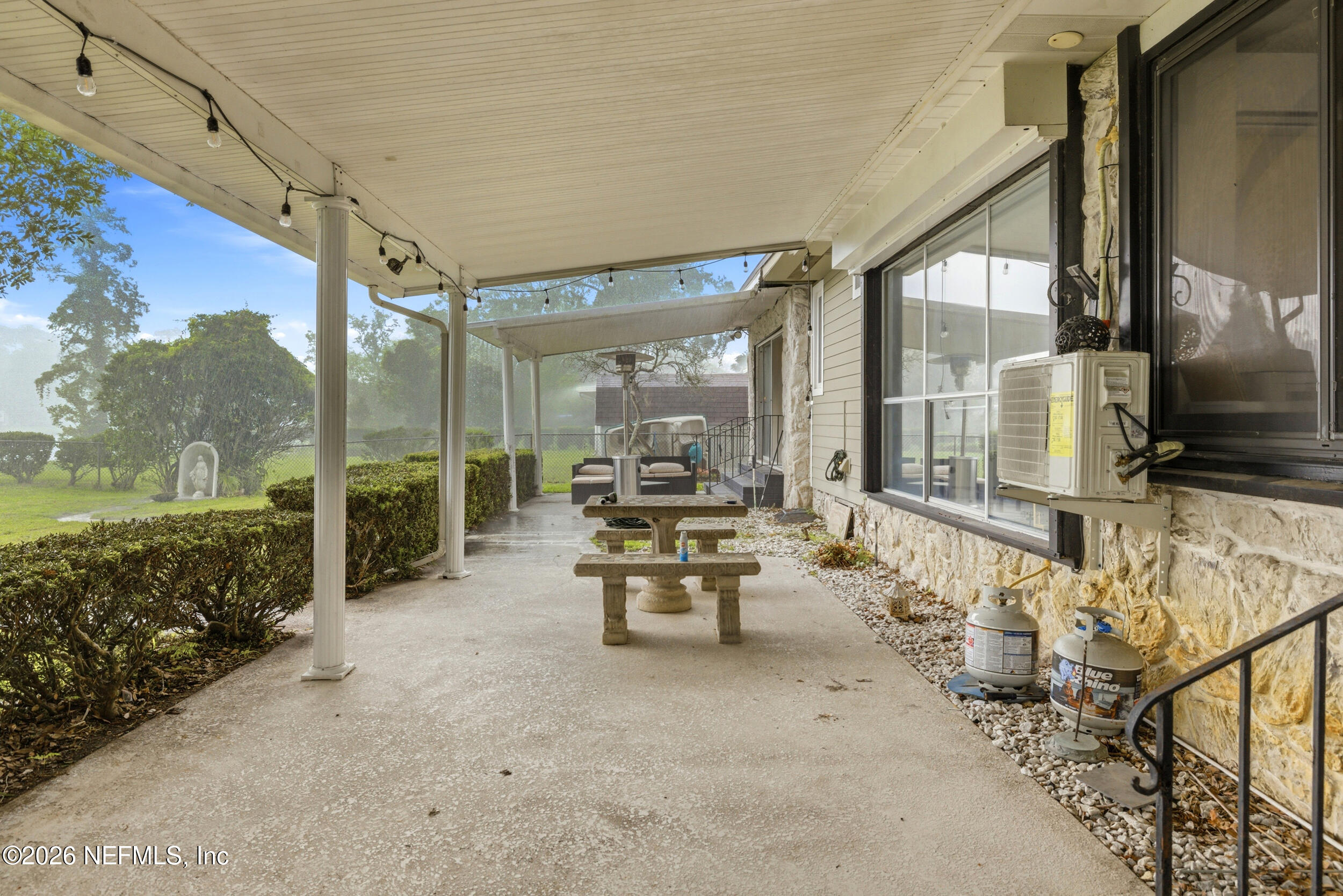 7484 Spinola Road Jacksonville, FL 32217 - Photo 49 of 63 a lobby with furniture and floor to ceiling window