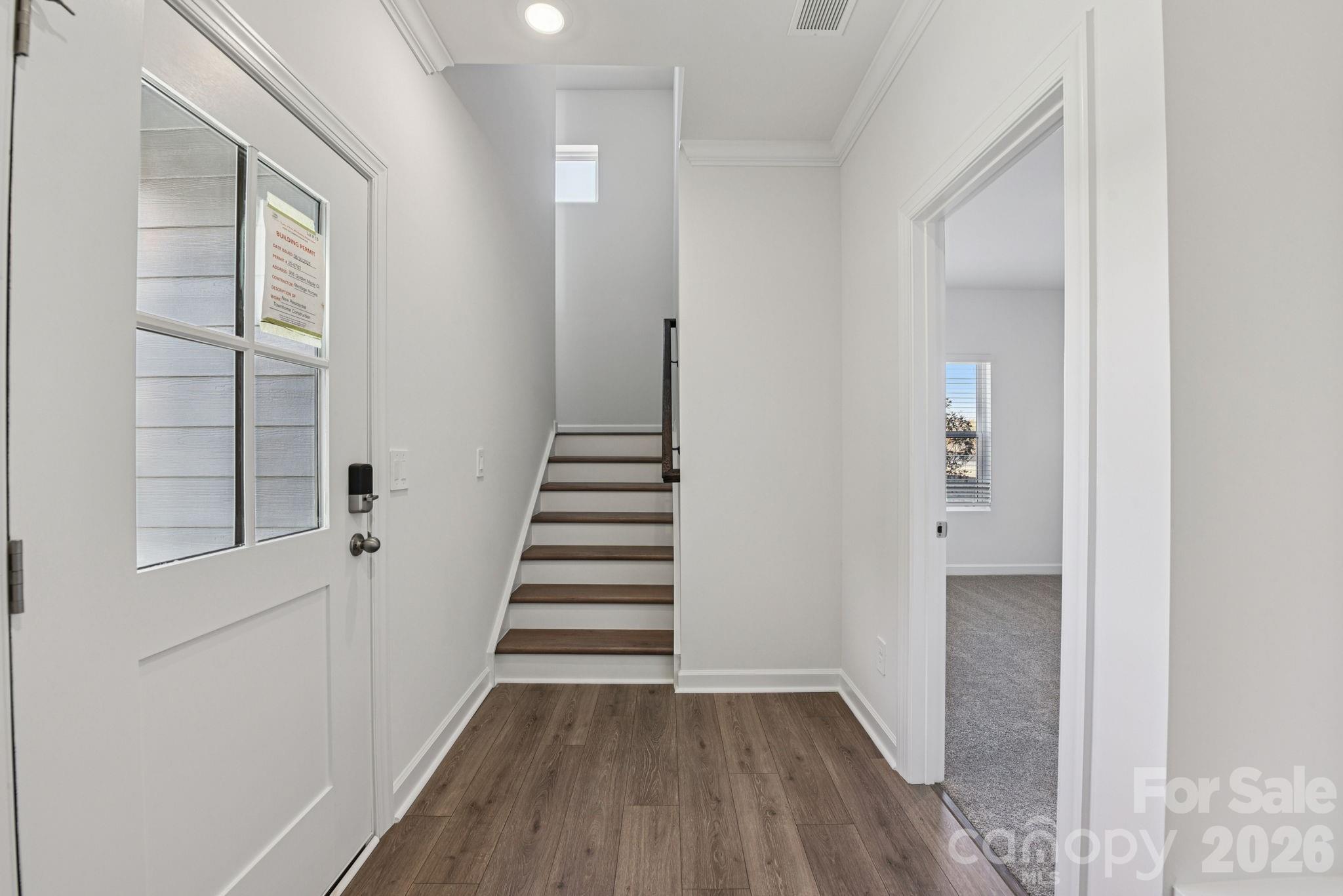 323 Golden Maple Court Fort Mill, SC 29708 - Photo 11 of 22 a view of a hallway with wooden floor and entryway