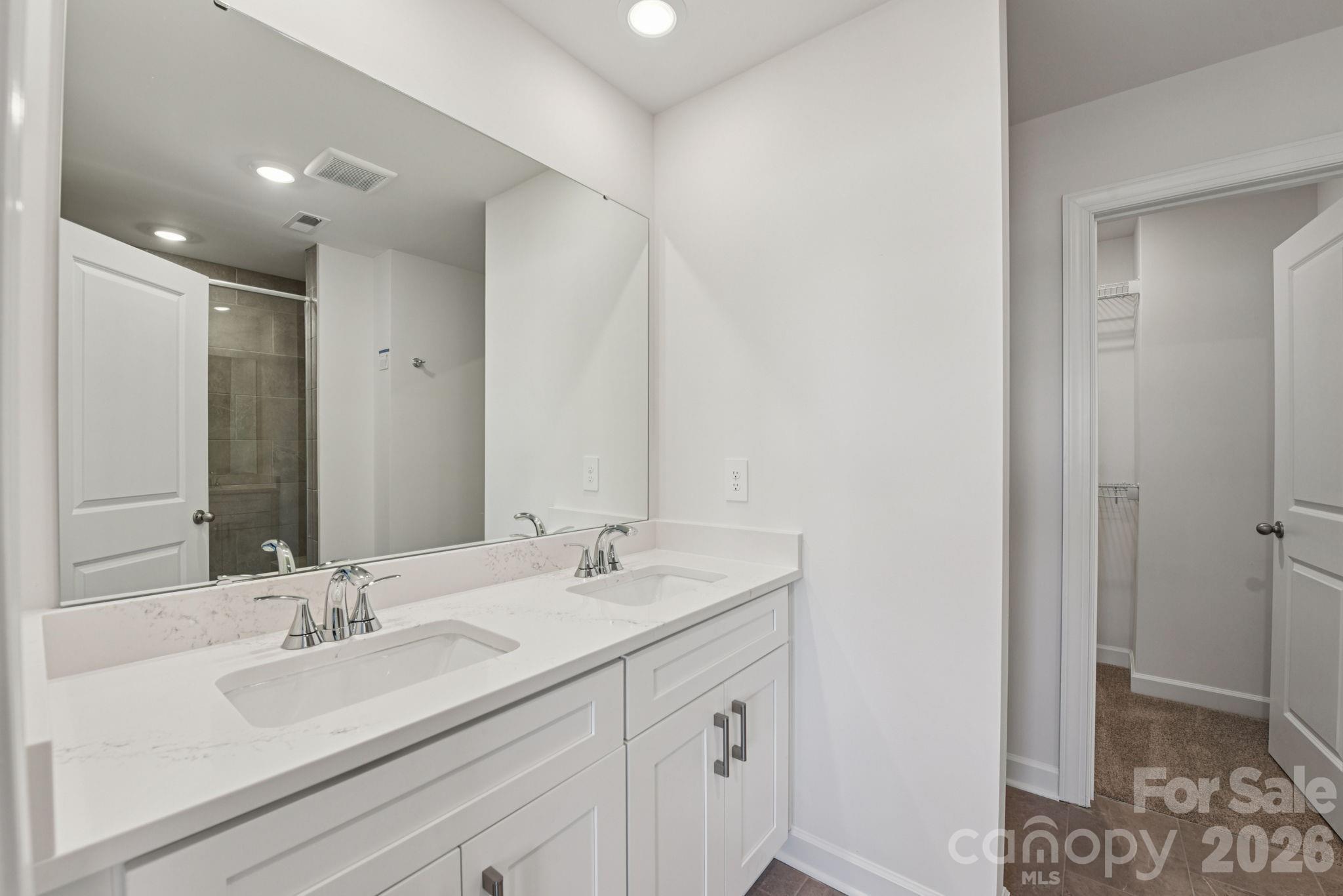 323 Golden Maple Court Fort Mill, SC 29708 - Photo 14 of 22 a bathroom with a sink and a mirror