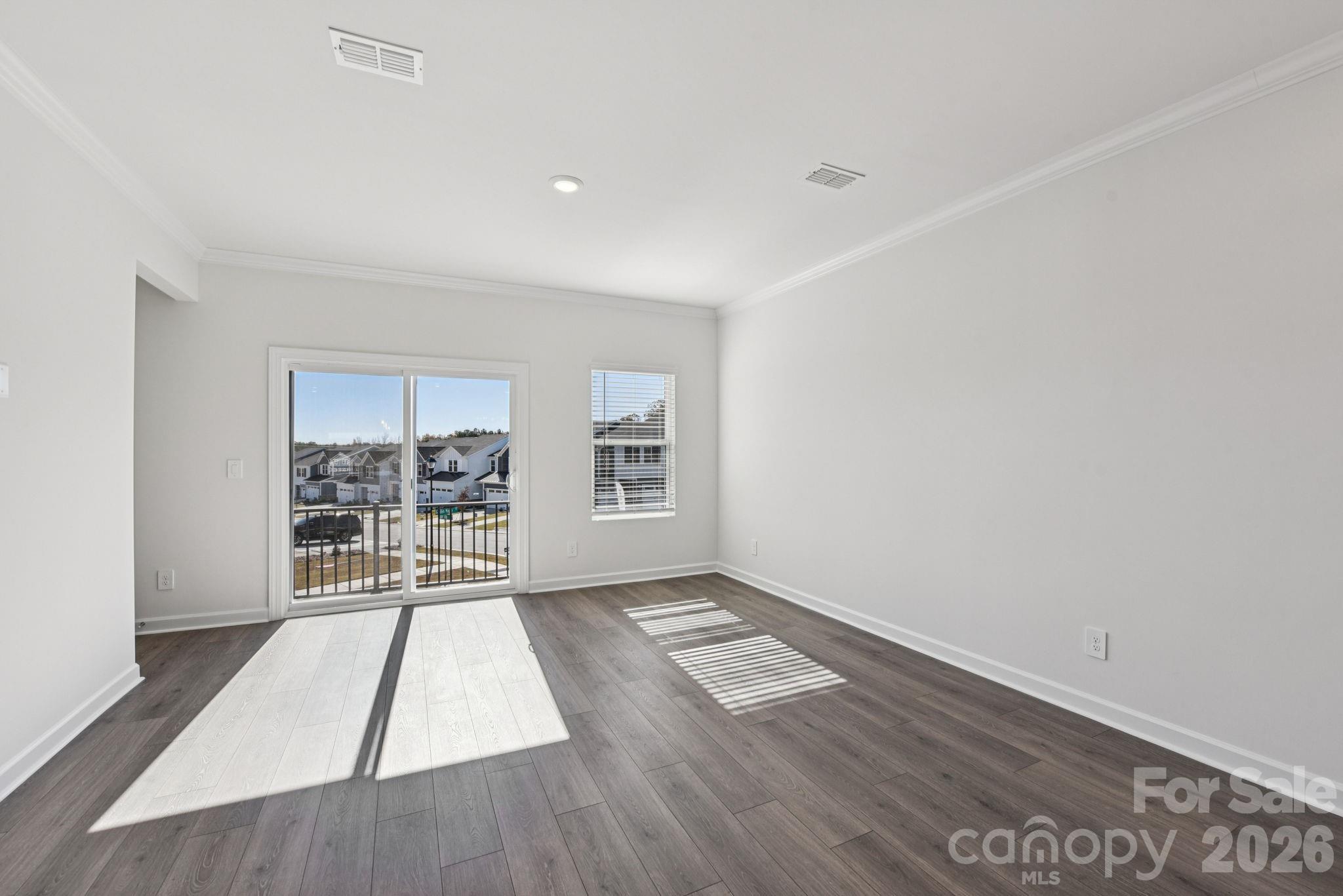 323 Golden Maple Court Fort Mill, SC 29708 - Photo 4 of 22 wooden floor in an empty room with a window