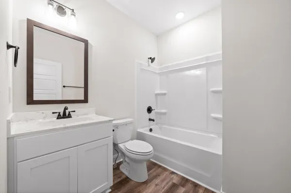 a bathroom with a toilet a sink and a bathtub