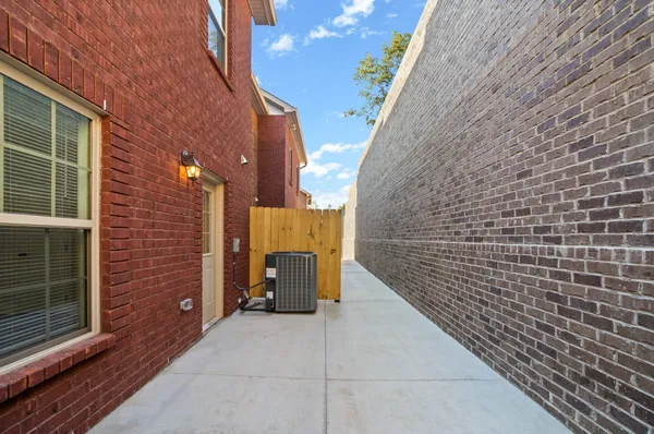 a view of entryway with brick walls