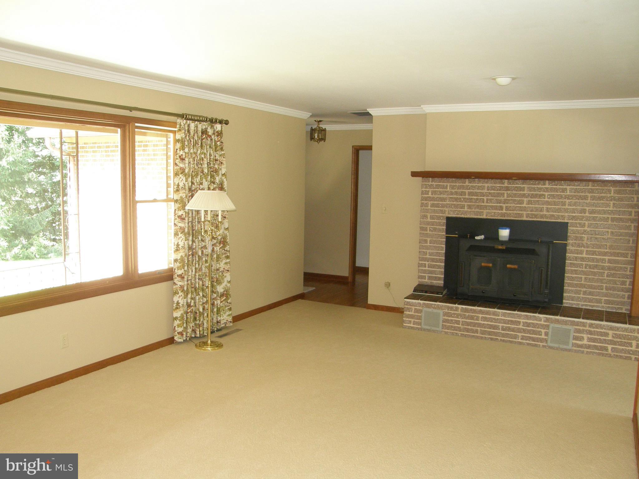44890 Clarks Mill Road Hollywood, MD 20636 - Photo 8 of 36 Living Room with woodstove insert