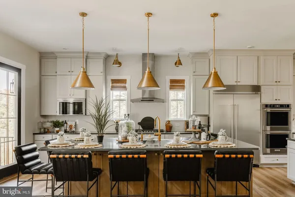 a dining table chairs and a wooden floor