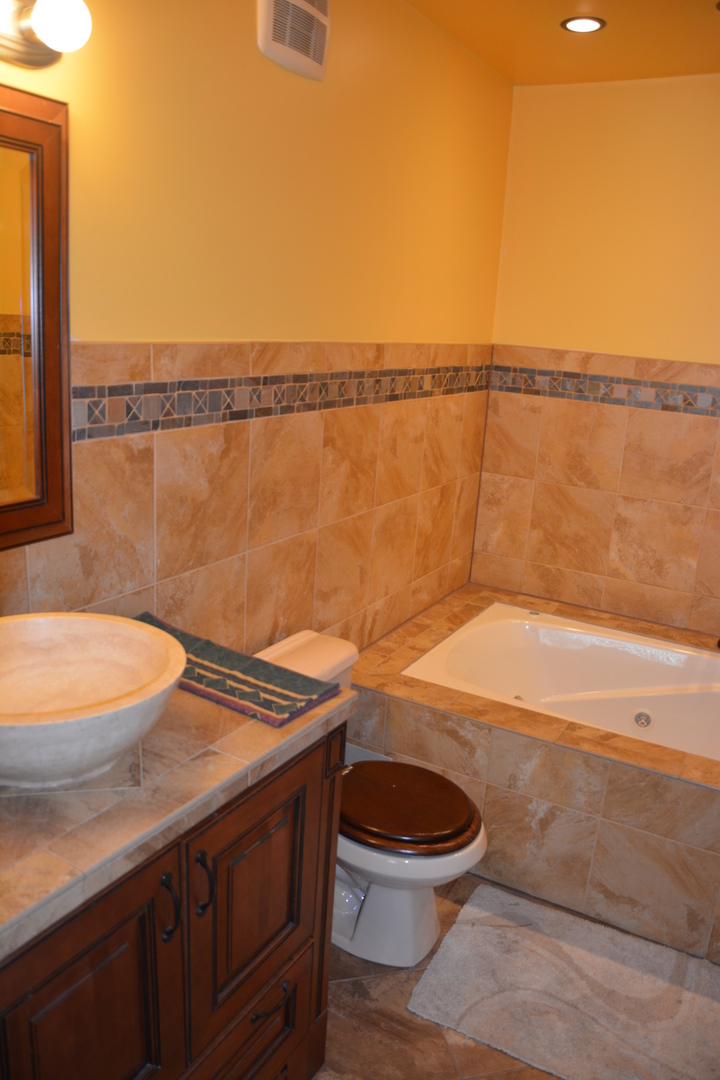 711 Tipperary Court, Unit 2D Schaumburg, IL 60193 - Photo 14 of 17 a view of a bathroom with a sink and a toilet