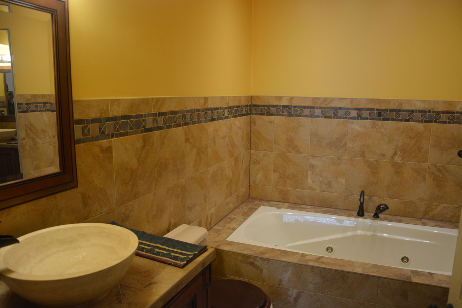 711 Tipperary Court, Unit 2D Schaumburg, IL 60193 - Photo 15 of 17 a bathroom with a sink and a mirror