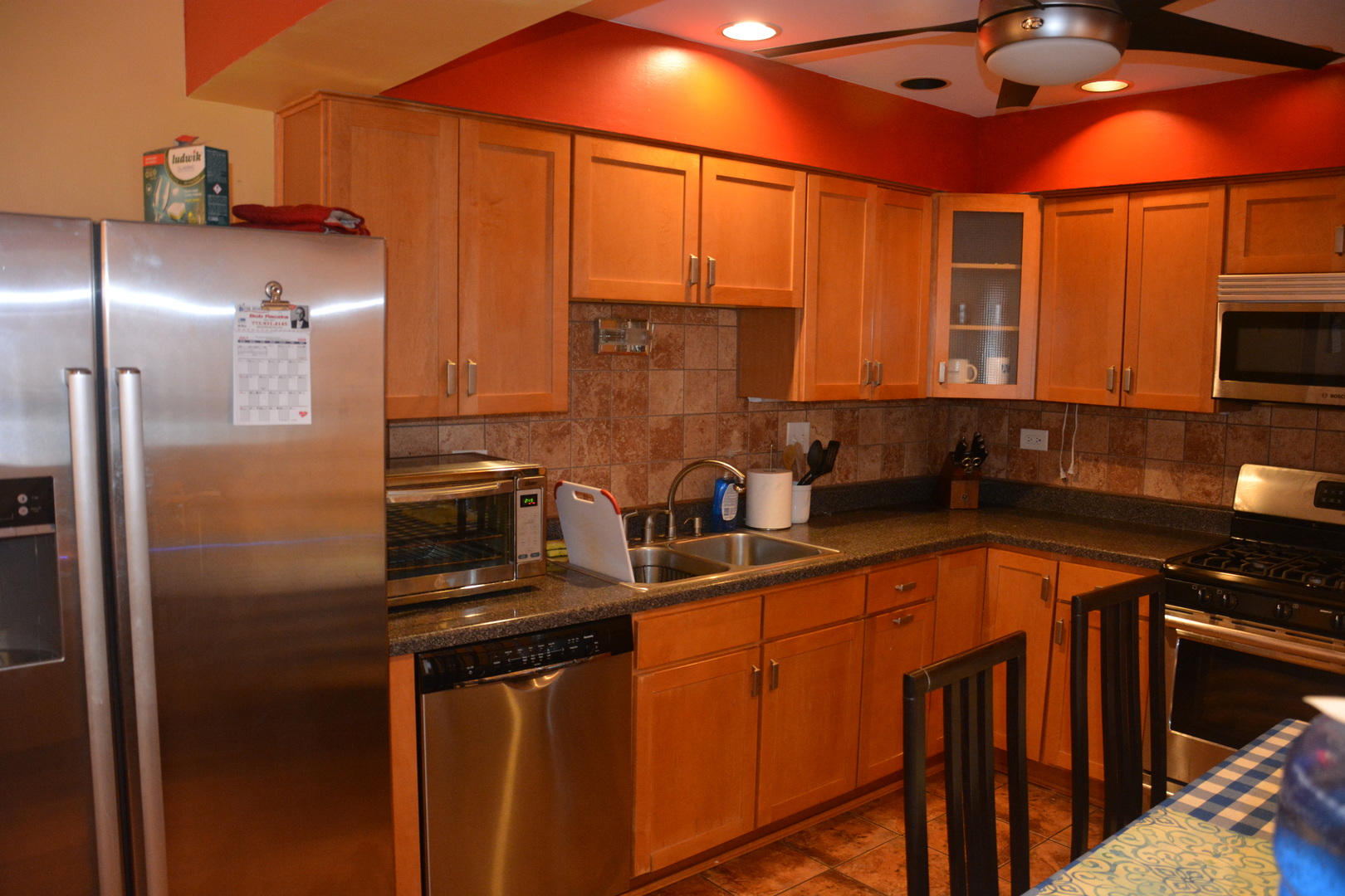 711 Tipperary Court, Unit 2D Schaumburg, IL 60193 - Photo 3 of 17 a kitchen with stainless steel appliances granite countertop a sink a stove and a refrigerator