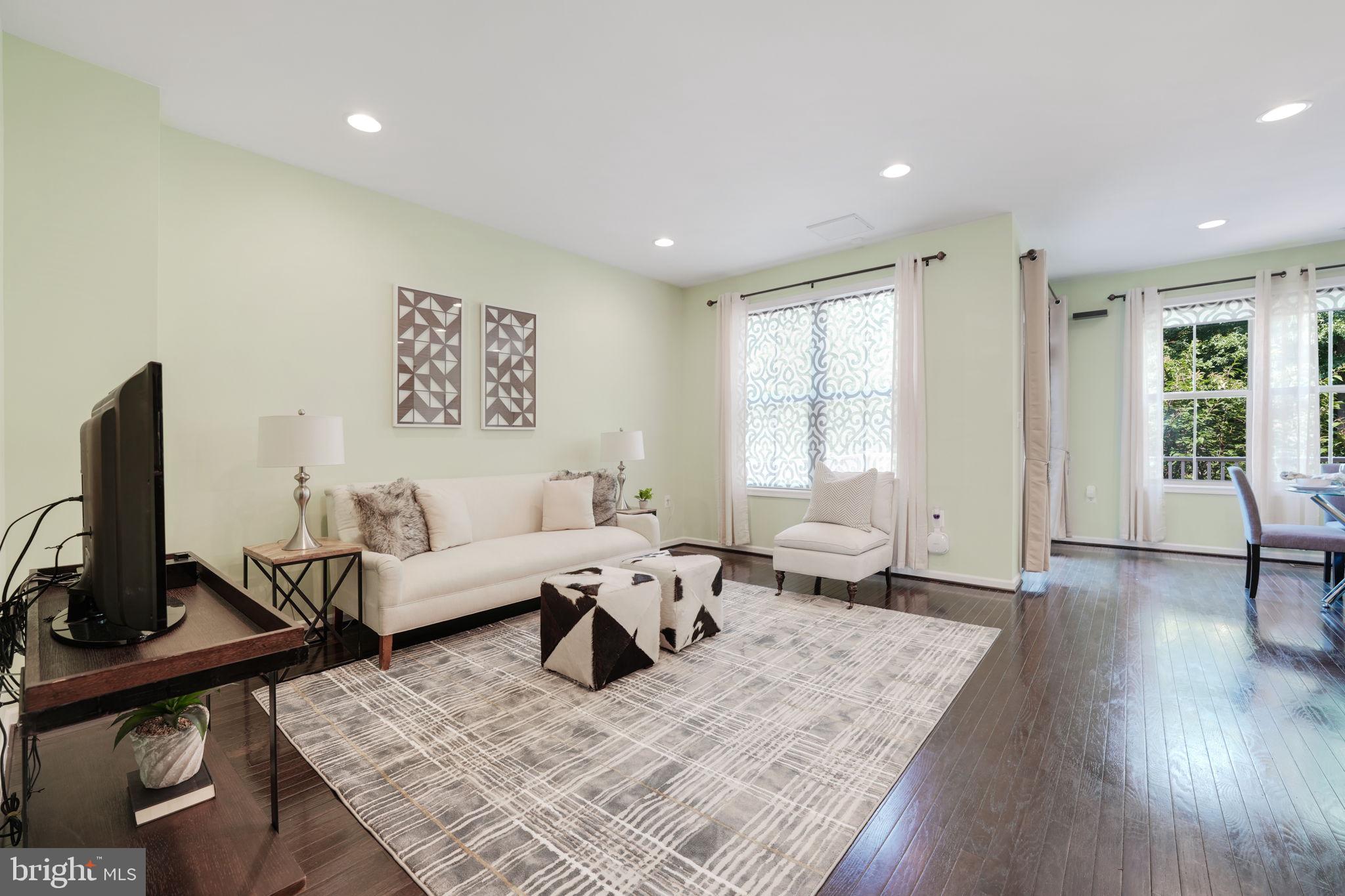 23339 Tradewind Drive Brambleton, VA 20148 - Photo 11 of 54 Living room off kitchen