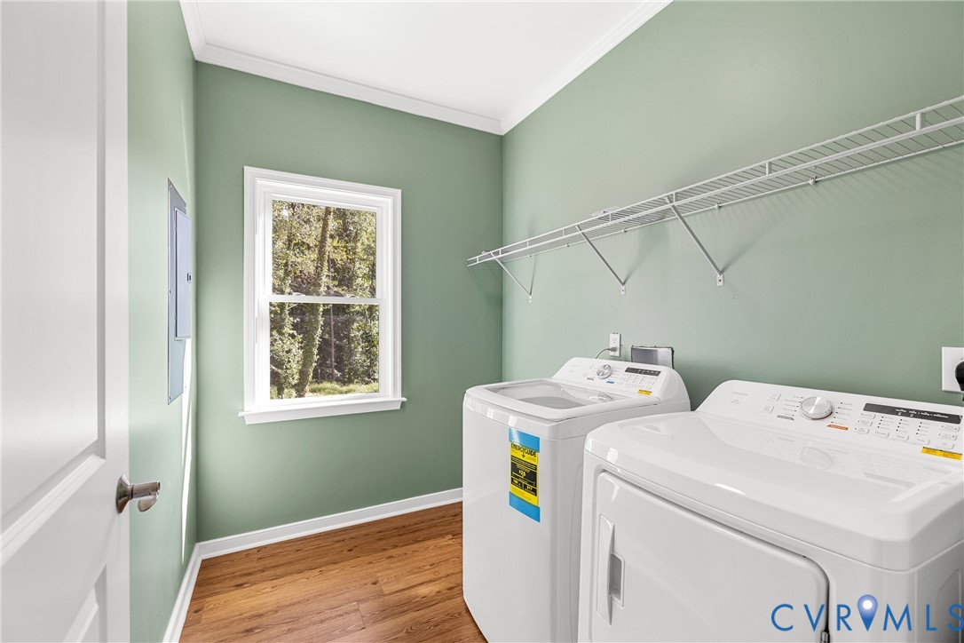 2211 Osborne Road Chester, VA 23831 - Photo 21 of 42 Laminate flooring with white trim, a single window