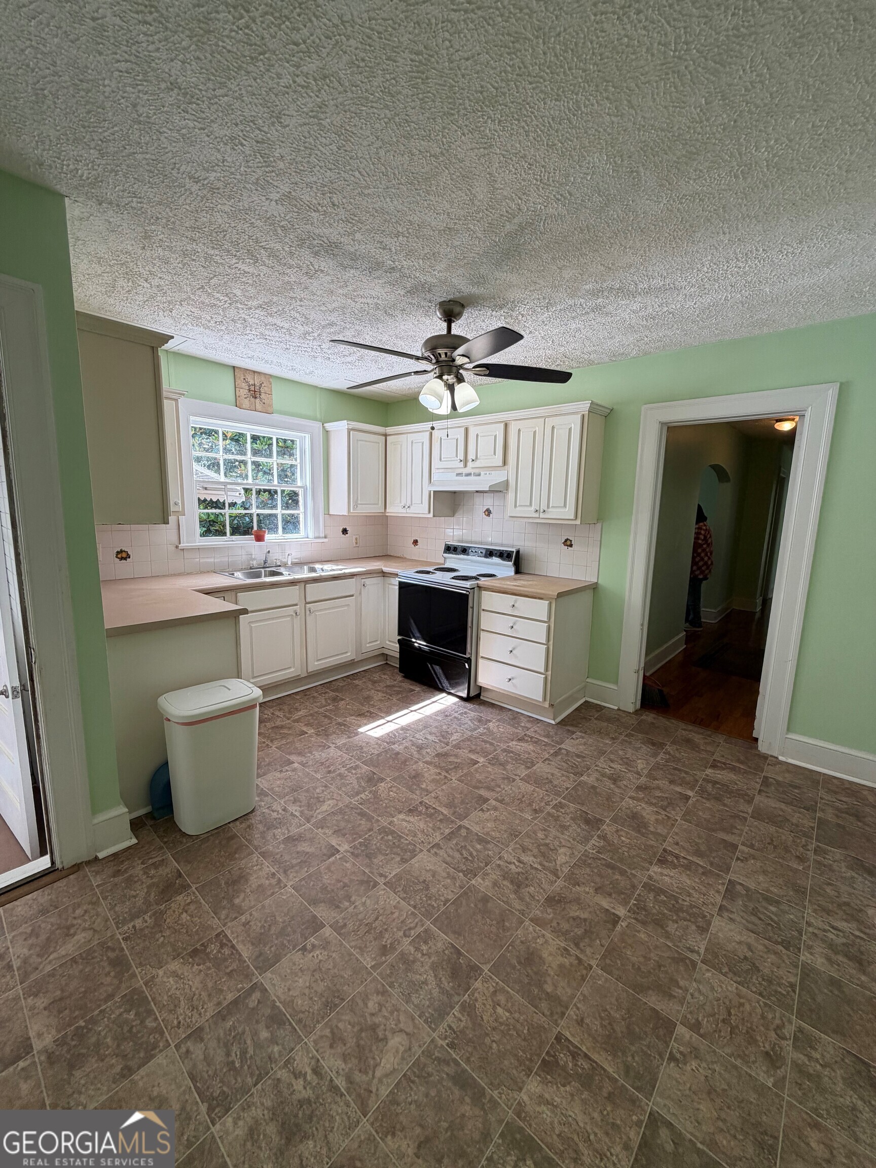 2619 Maple Road Southeast Rome, GA 30161 - Photo 22 of 31 a kitchen with a sink and a stove