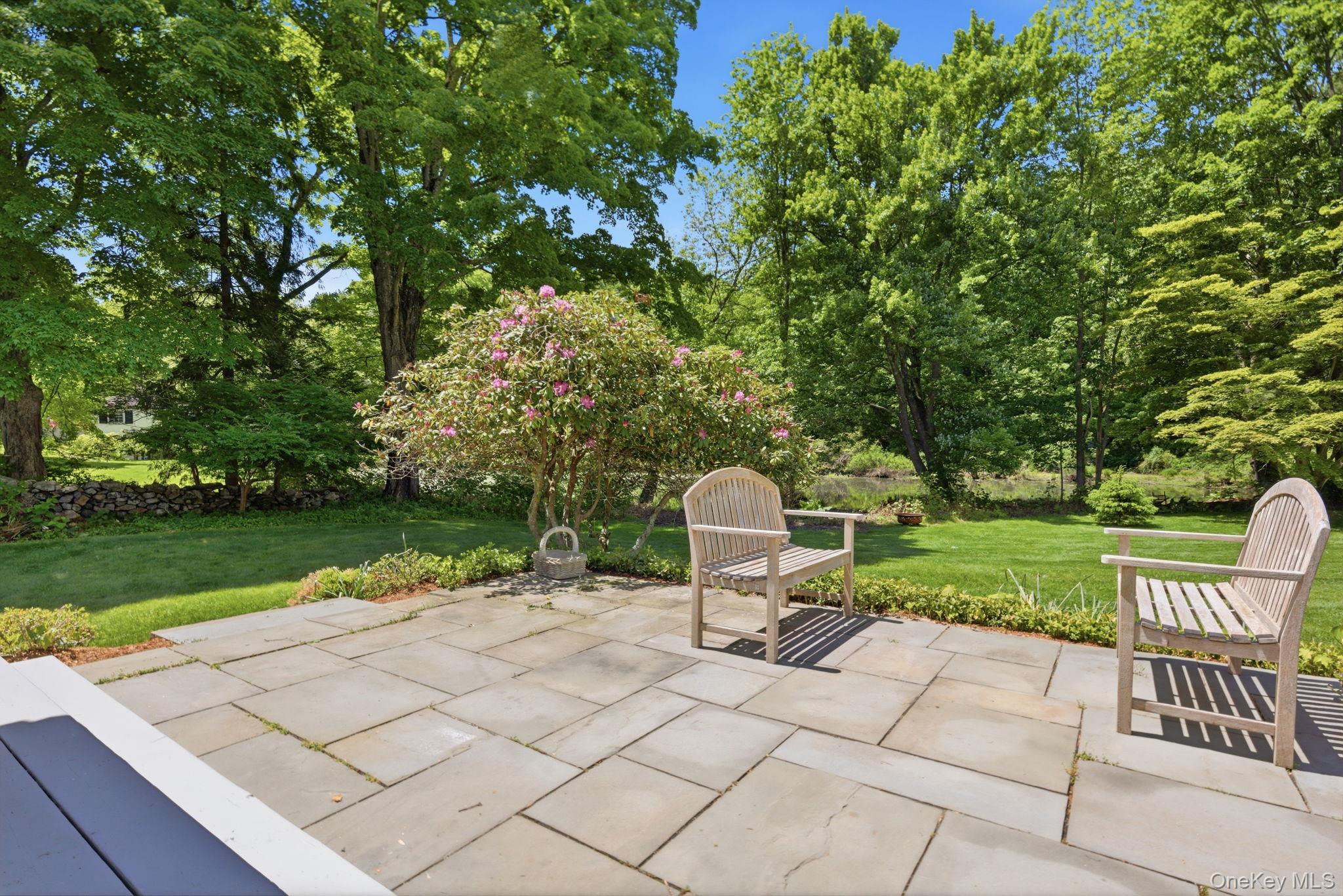 23 Pound Ridge Road Pound Ridge, NY 10576 - Photo 27 of 40 a view of a garden with an outdoor seating