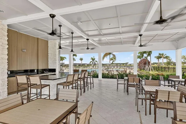 a dining room with furniture window and outdoor view