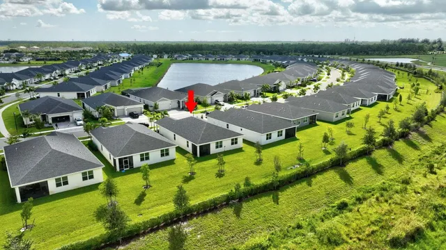 an aerial view of a house with a lake view