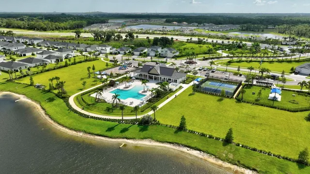 a view of a swimming pool with a table and chairs