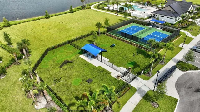 swimming pool view with a garden view