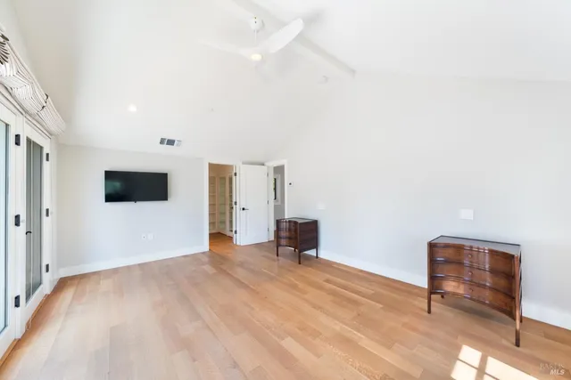 a view of a livingroom with a chair and a fireplace