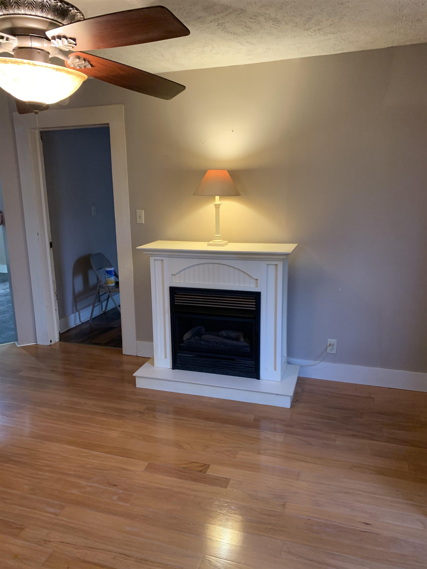 7641 Highway 45 Ramer, TN 38367 - Photo 15 of 24 a view of empty room with wooden floor and fireplace