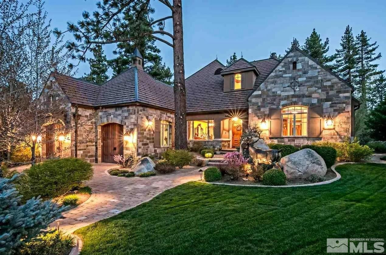 a view of a house with backyard porch and sitting area