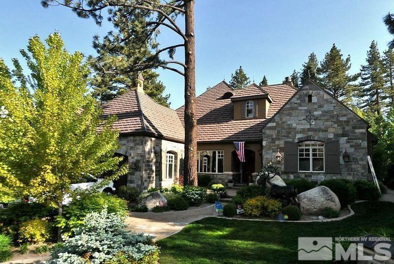 6574 Champetre Court Reno, NV 89511 - Photo 2 of 21 a front view of a house with a yard and potted plants