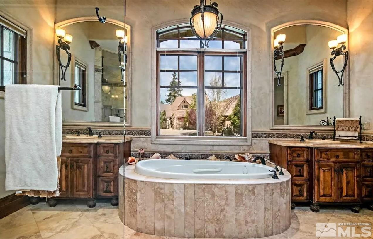 6574 Champetre Court Reno, NV 89511 - Photo 10 of 21 a spacious bathroom with a tub sink and mirror