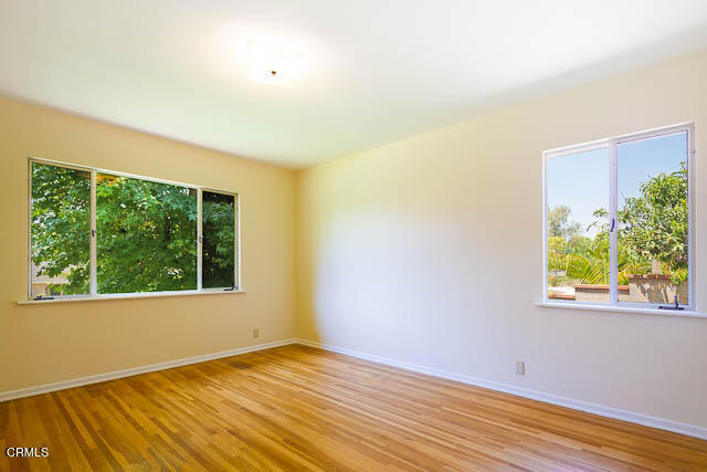 3665 Shadow Grove Road Pasadena, CA 91107 - Photo 13 of 27 a view of an empty room with wooden floor and a window