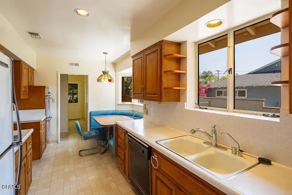 a bathroom with a granite countertop sink mirror and a bathtub