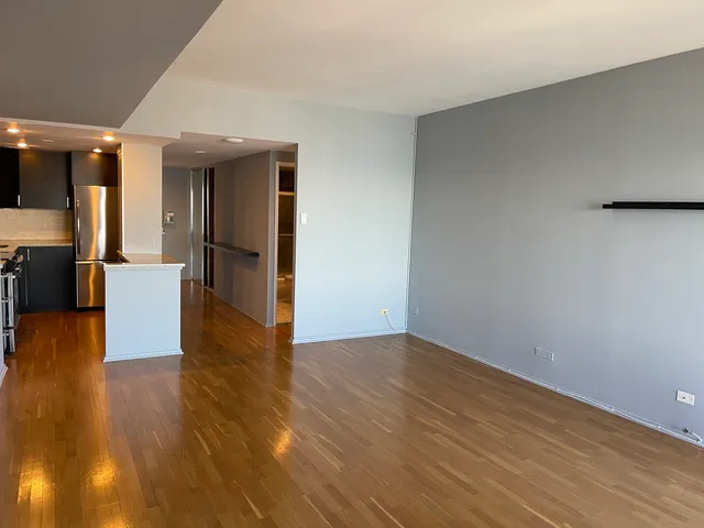 a view of a livingroom with furniture and wooden floor