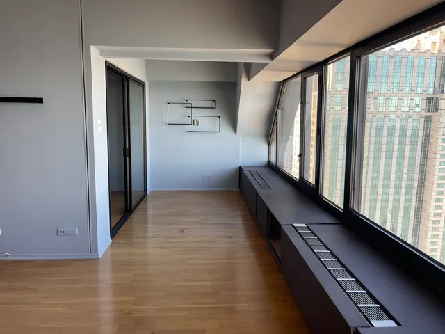 a view of entryway with wooden floor and stairs