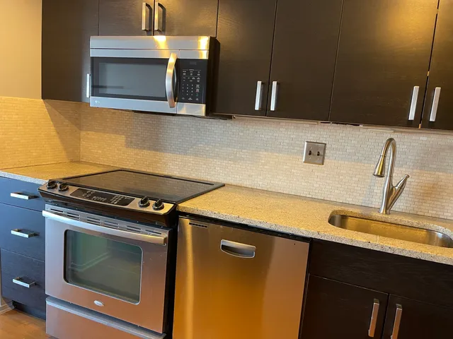 a kitchen with a stove and a microwave