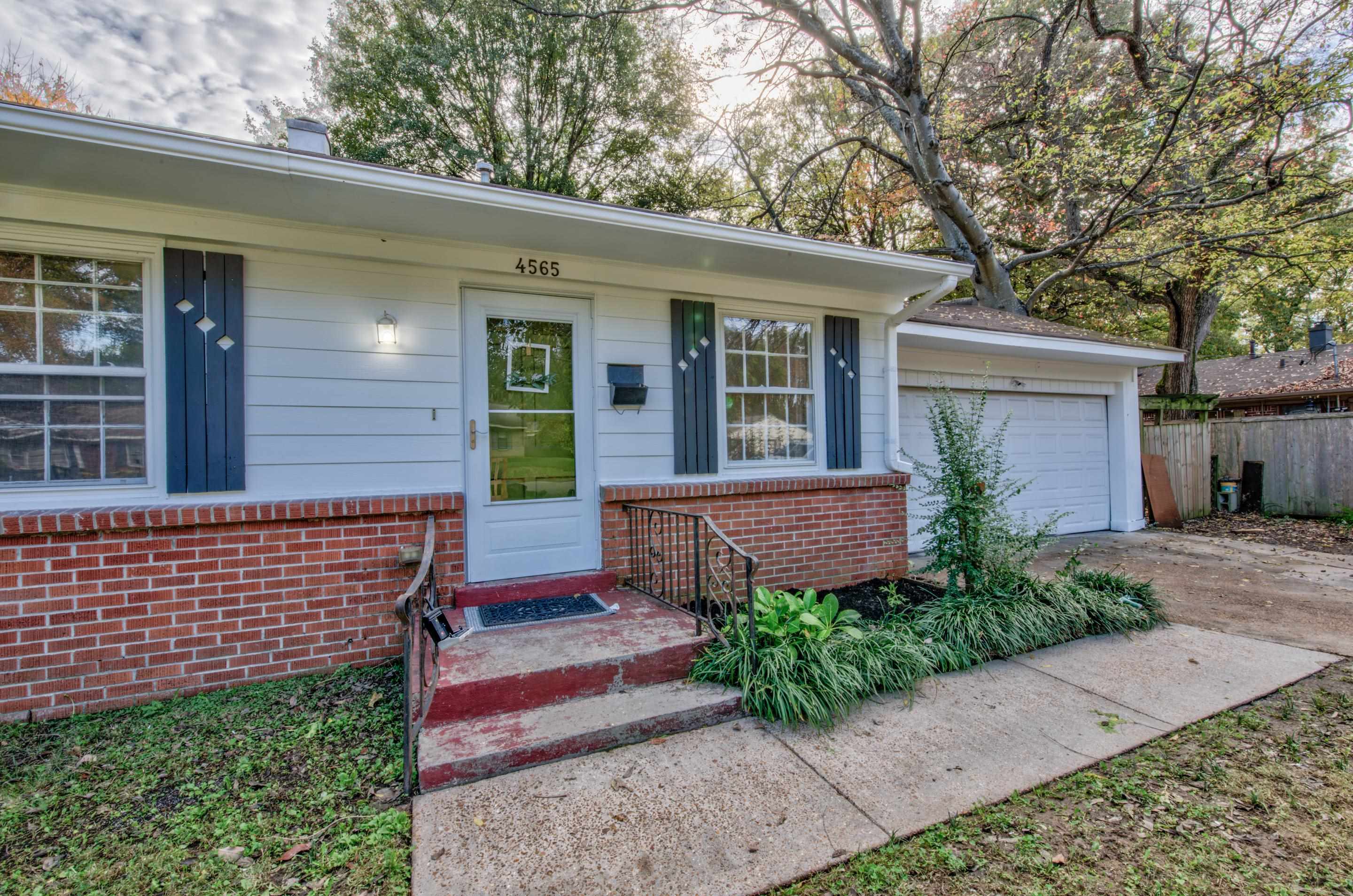 4565 Monaco Road Memphis, TN 38117 - Photo 1 of 23 front view of a house with a bench