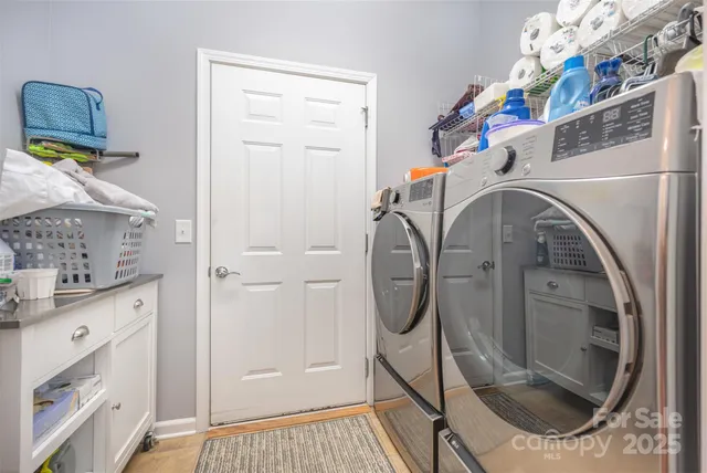 a bathroom with a sink a mirror and shower