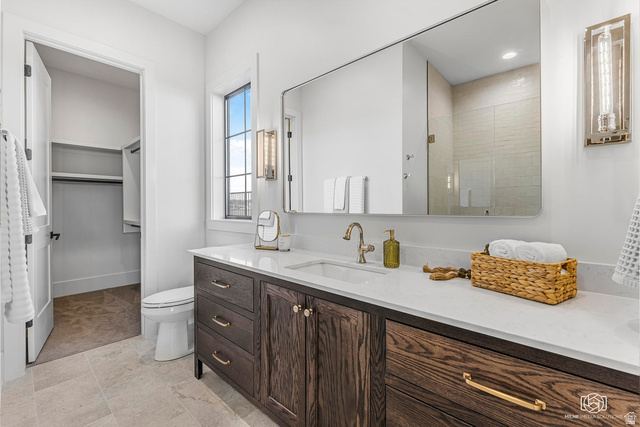 1468 South Red Cliffs Temple Lane St. George, UT 84790 - Photo 33 of 64 Bathroom featuring a shower stall, vanity, and a spacious closet