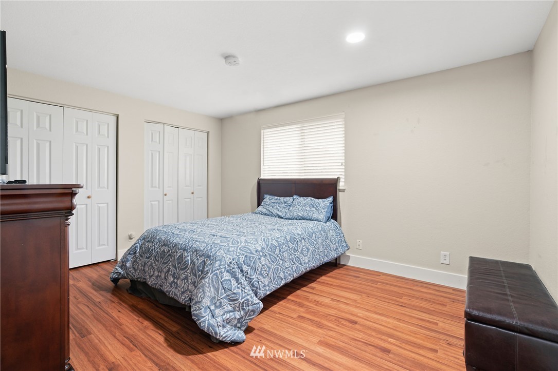 2312 168th Street Southeast Bothell, WA 98012 - Photo 11 of 29 a bedroom with a bed and wooden floor