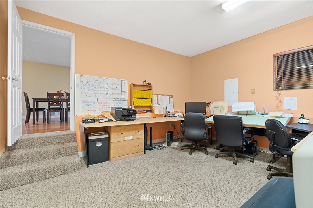 2312 168th Street Southeast Bothell, WA 98012 - Photo 16 of 29 a view of a workspace with furniture and a window