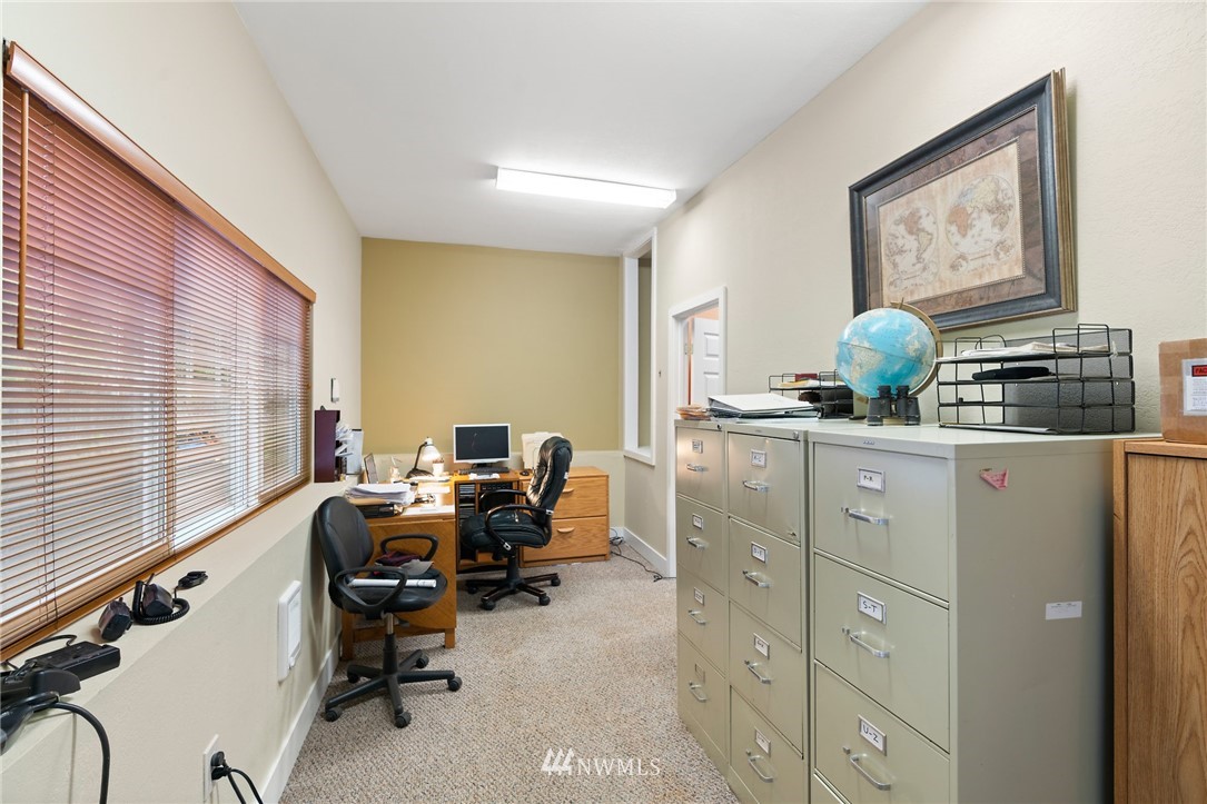 2312 168th Street Southeast Bothell, WA 98012 - Photo 17 of 29 a view of a workspace with furniture and a window