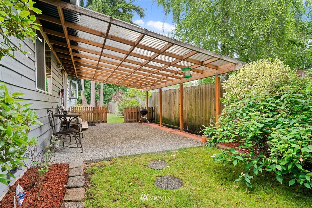 2312 168th Street Southeast Bothell, WA 98012 - Photo 25 of 29 a view of patio with table and chairs and potted plants