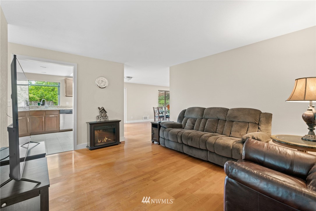 2312 168th Street Southeast Bothell, WA 98012 - Photo 4 of 29 a living room with furniture and a fireplace